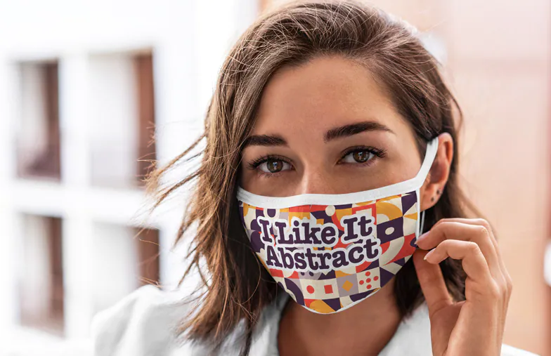 Young woman running and wearing personalised face mask with fashion design