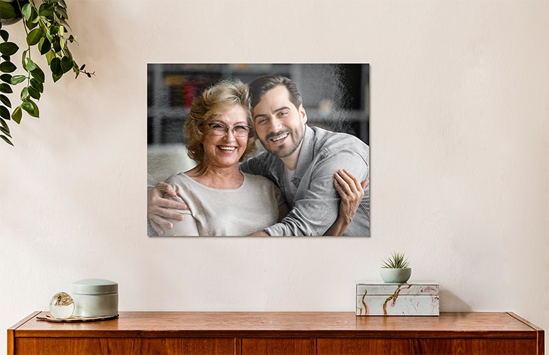 Aluminium photo print of a moutain and a lake being held by woman made by Printerpix
