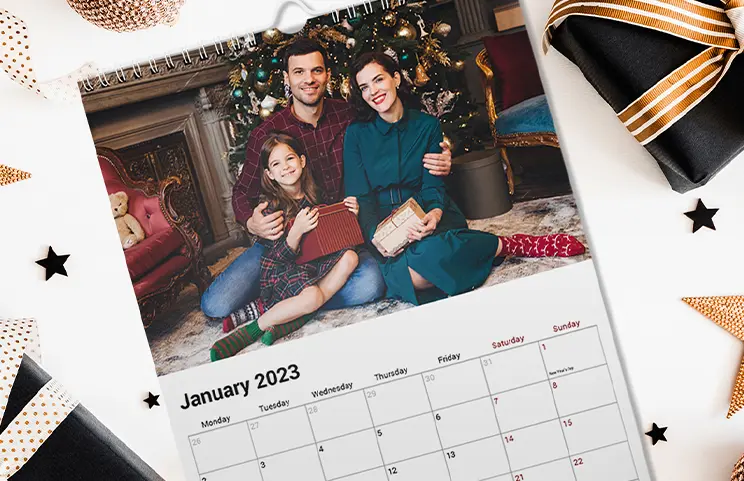 Girlfriend photo on personalised wall calendar hung up in living room