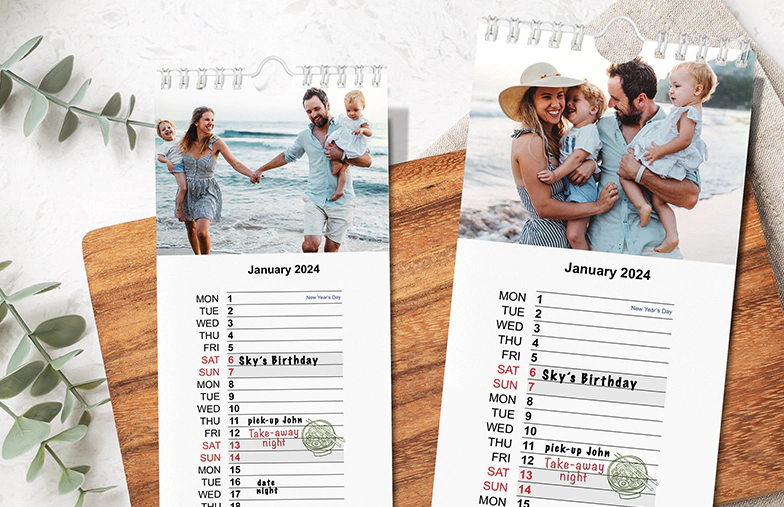Woman writing on A4 customised wall calendar by printerpix with christmas theme photo