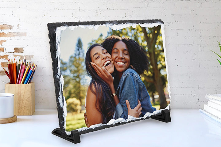 two young people printed on a stone