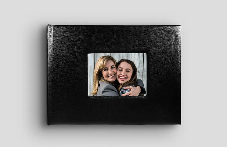 Black leather photobook with window in the cover and picture of mum and daughter