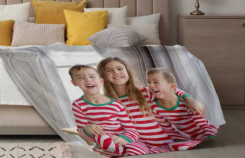 Mink Touch Photo Blanket by Printerpix|Printerpix photo blanket with photos of family|Large photo blanket on double bed with picture of girl photo|Photo blanket image with size comparison|Photo blanket black and white collage image||||||
