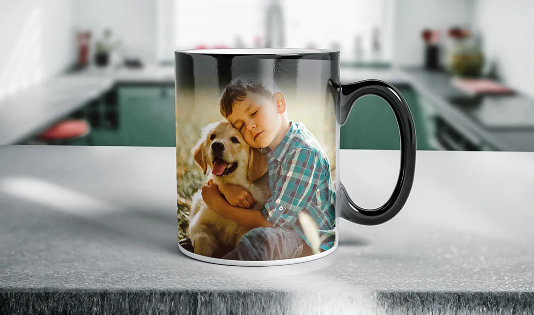 Printerpix Custom magic heat changing mug with personalised photo of a baby revealed|Printerpix Custom magic heat changing mug with personalised photo of a baby revealed|Young boy holding custom designed magic mug with photo of himself on|Magic mug with picture of cat on having tea poured into it on desk|Couple holding two heat changing magic mugs with custom text by Printerpix|Personalised magic mug with revealed photo of young woman|||||