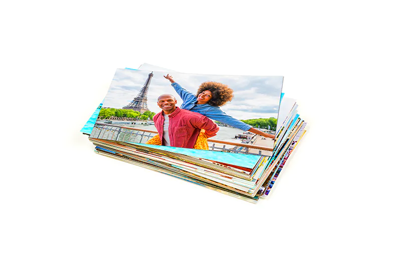 Stack of custom photo prints from the Printerpix online photo printing service