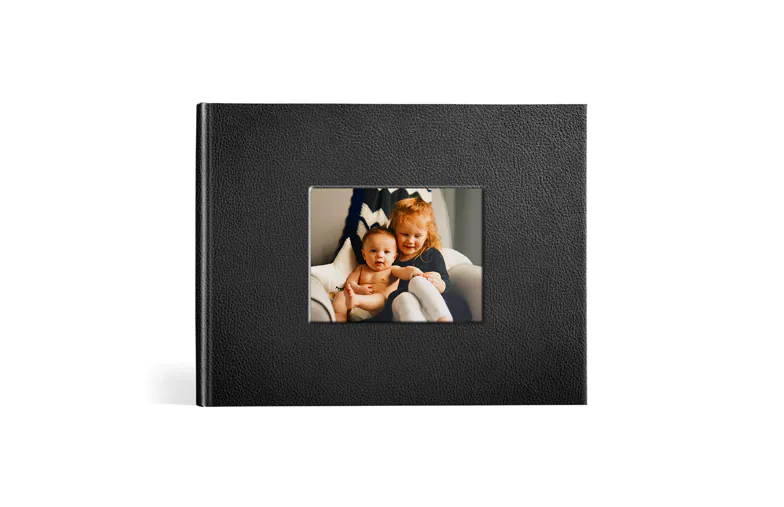 Black leather photobook with window in the cover and picture of mum and daughter