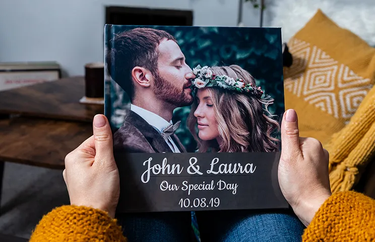 Custom printed Printerpix photo album with hard cover and large photos of old couple