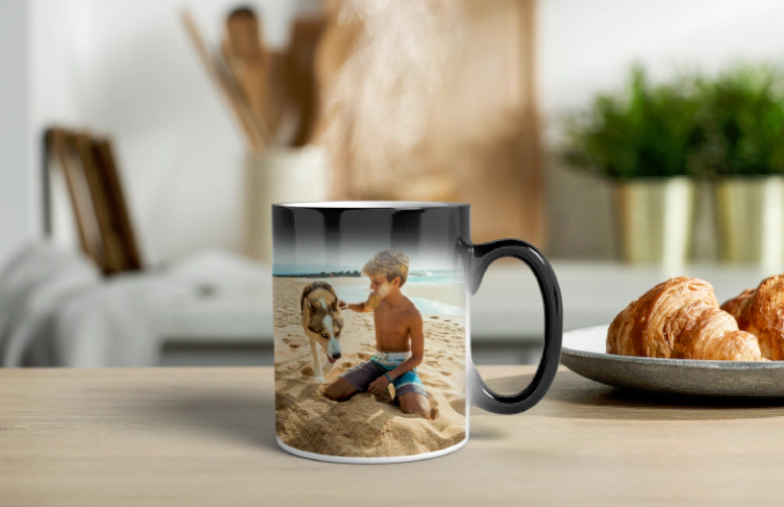 Printerpix Custom magic heat changing mug with personalised photo of a baby revealed|Printerpix Custom magic heat changing mug with personalised photo of a baby revealed|Young boy holding custom designed magic mug with photo of himself on|Magic mug with picture of cat on having tea poured into it on desk|Couple holding two heat changing magic mugs with custom text by Printerpix|Personalised magic mug with revealed photo of young woman|||||