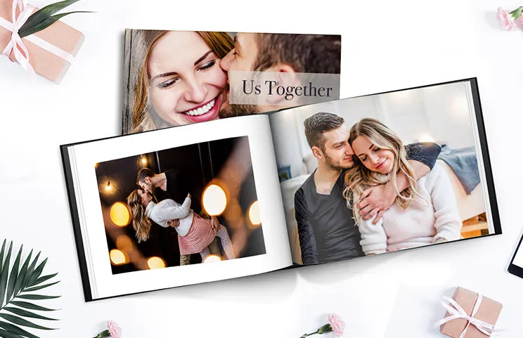 Personalised photo album book with romantic pictures of a couple and photo cover