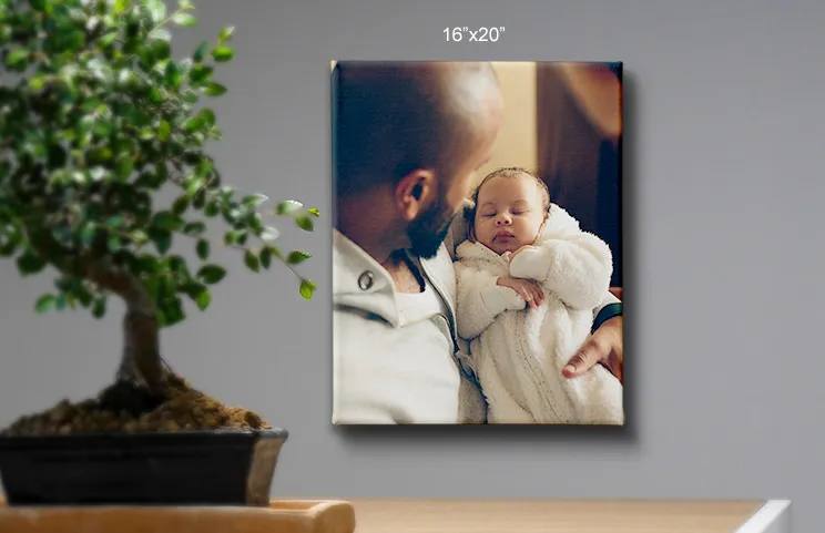 16x20 canvas of father holding baby