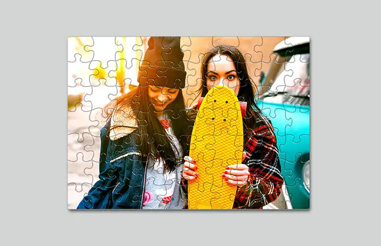 Cardboard puzzle of two girls