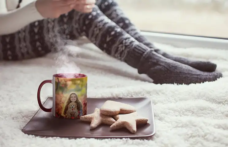 Personalised red mug with photo of young girl on next to cookies