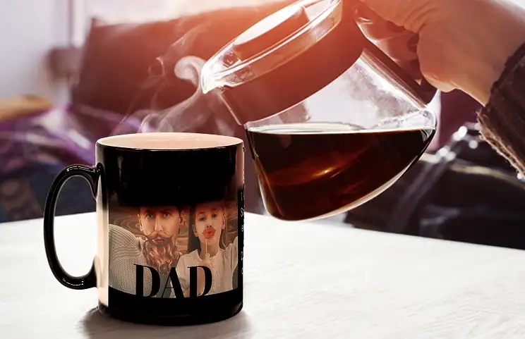 Tea from kettle pouring into magic mug