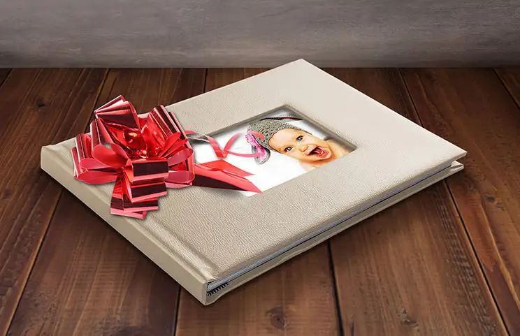 Beige colour leather photobook with window cover and baby photo