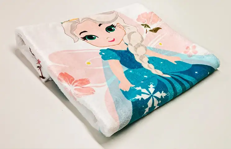 Close up photo of blue folded custom elsa princess blanket by Printerpix