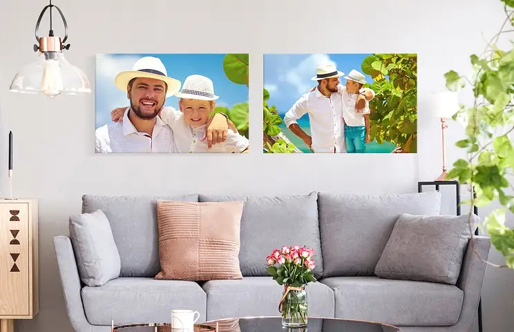 Woman placing canvas print on wall