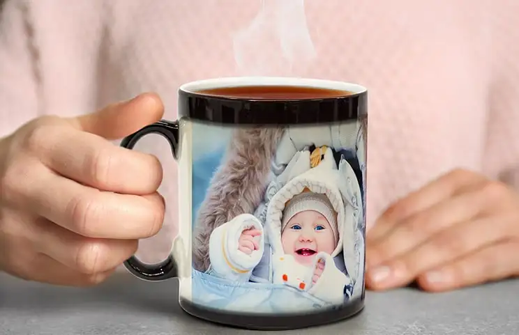 Personalised magic mug with revealed photo of young woman
