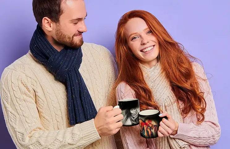 Couple holding magic mugs